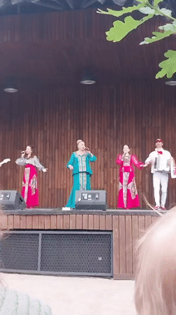 Outdoor musical concert performed on wooden stage in Orenburg