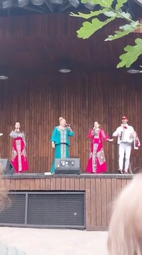 Outdoor musical concert performed on wooden stage in Orenburg