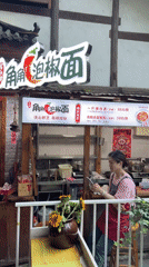Outdoor restaurant bustling with diners in Beibei, China