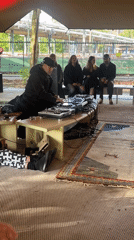 DJ performs outdoor tent show for small crowd in The Hague