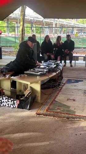 DJ performs outdoor tent show for small crowd in The Hague