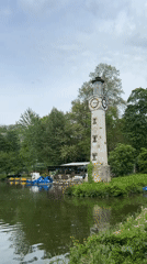 Clock tower lighthouse observed by lake in Pleven Bulgaria