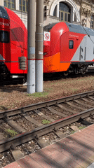 Morning commuters gather at train station platform