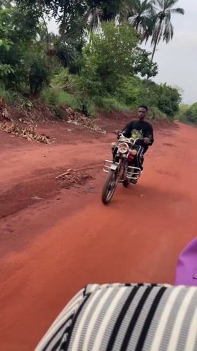 Rural dirt road journey documented in Opu, Nigeria