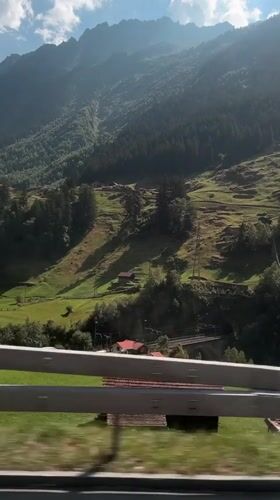 Alpine scenery rolls by on a mountain road near Wassen