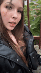 Woman filmed on rainy Varna street during evening hours