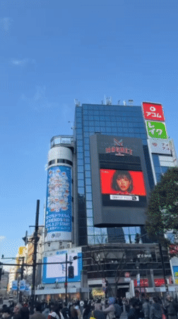 Morning pedestrians navigate Tokyo's famous Shibuya Crossing