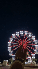 Budva summer night: Ferris wheel, live sax, and ice cream