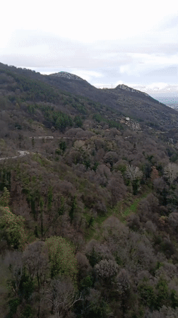 Mountain vista with Bulgarian flag filmed near Asenovgrad