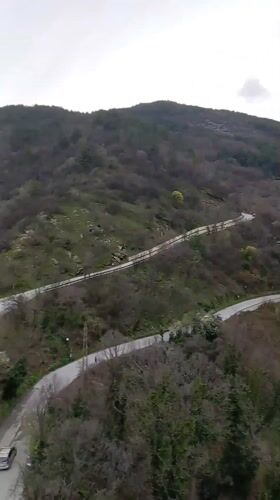 Mountain vista with Bulgarian flag filmed near Asenovgrad