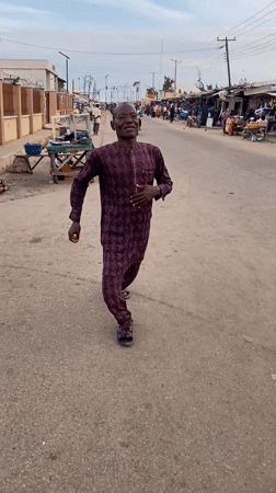 Street scene captured in Lokoja with vendors and pedestrians