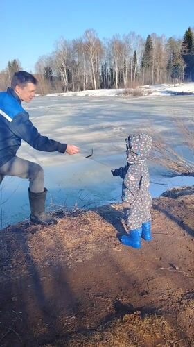 Family cookout by frozen lake in Markovo, Russia