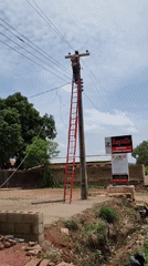 Utility worker performs pole maintenance in Jos, Nigeria