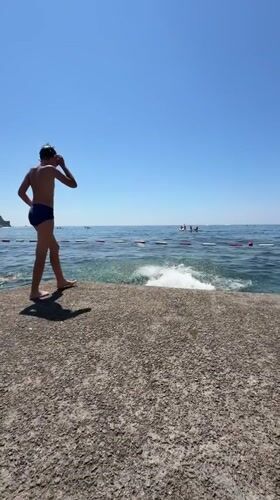 Rocky shoreline moments in Budva on a sunny summer morning