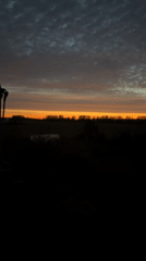 Vivid sunset over a rural Russian town at dusk