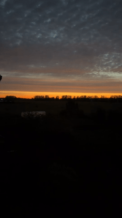 Vivid sunset over a rural Russian town at dusk