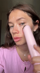 Woman performs morning skincare routine in Tel Aviv