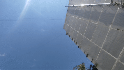 Around a Kremenchuk building on a clear summer afternoon