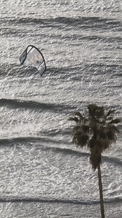 Kitesurfing kite spotted floating over ocean near Bat Yam
