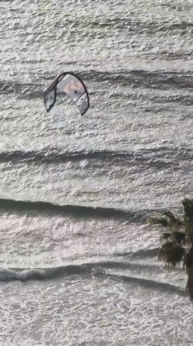 Kitesurfing kite spotted floating over ocean near Bat Yam