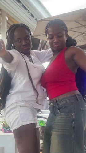 Women celebrate with wine and dancing at Lagos waterfront restaurant