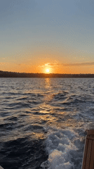 Sunset observed from boat off Procida, Italy coast