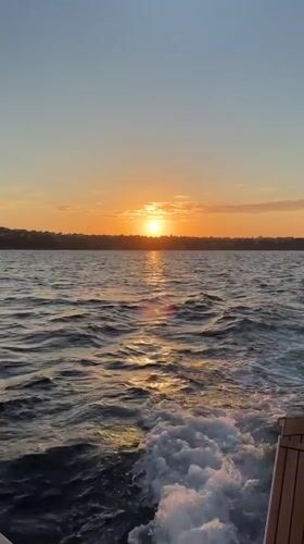Sunset observed from boat off Procida, Italy coast