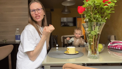 Morning kitchen routine captured in Khimki with dancing woman, toddler