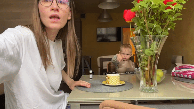 Morning kitchen routine captured in Khimki with dancing woman, toddler