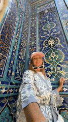 Tourists explore historic Samarkand necropolis on sunny morning