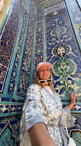 Tourists explore historic Samarkand necropolis on sunny morning