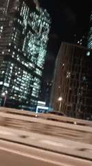 Moscow skyline captured from moving vehicle at night