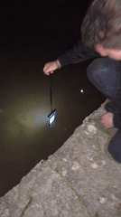 Person observed kneeling by water in Getsovo, Bulgaria