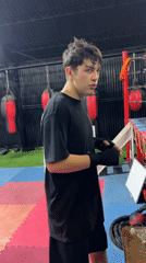 Hand wrapping and drills at a boxing gym in Arica