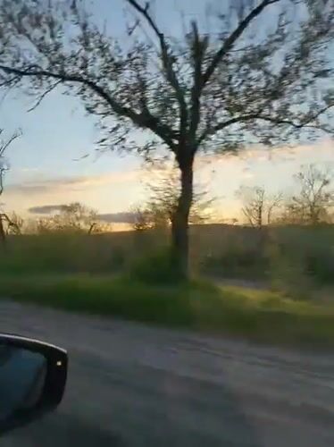 Driver captures sunset view while traveling through Kryvyi Rih