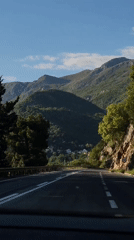 Driver navigates mountain road in Montenegro countryside