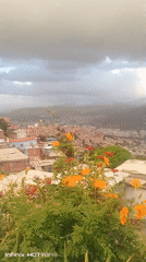 Evening documentation captures panoramic views of Caracas barrios
