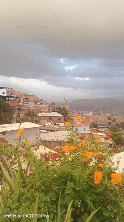 Evening documentation captures panoramic views of Caracas barrios