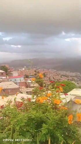 Evening documentation captures panoramic views of Caracas barrios