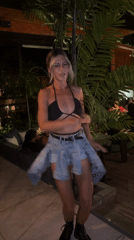 Woman poses on patio in North Kuta, Indonesia