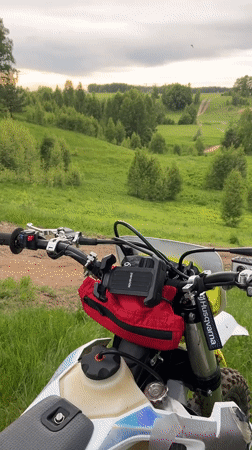 Dirt biker pauses for photos in Russian countryside