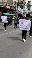 Youth demonstrate in matching tracksuits on La Paz streets