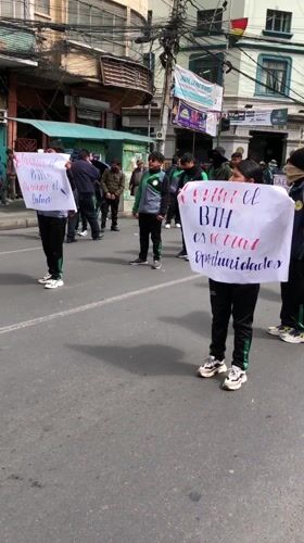 Youth demonstrate in matching tracksuits on La Paz streets