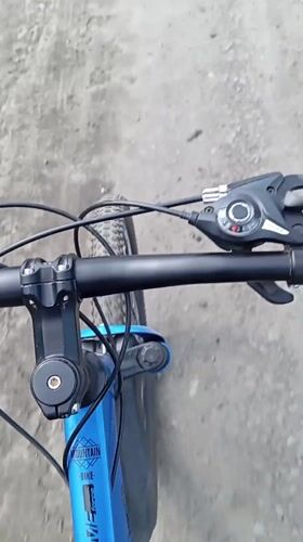 Cyclist rides mountain bike through Yurgamysh, Russia