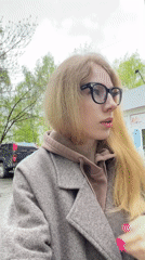 Everyday moments captured across Izhevsk: woman, book, cat