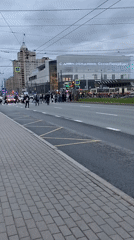 Large group crosses street at Saint Petersburg crosswalk