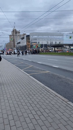 Large group crosses street at Saint Petersburg crosswalk