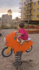 Kaliningrad courtyard life, playground and construction at dusk