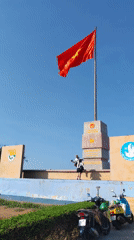 Vietnamese flag monument observed on sunny day in Phú Quý