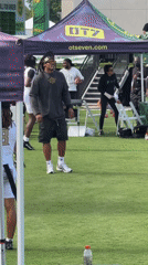 Football throw on turf field at LA sports event